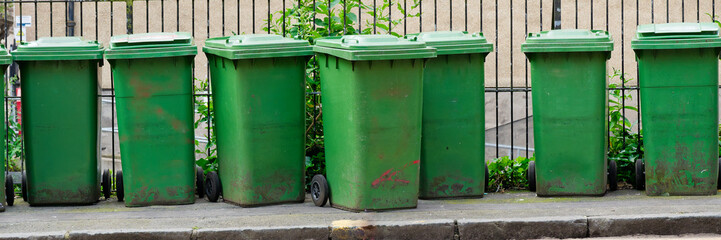 Wheelie bins in row for refuge collection outdoors