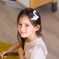 portrait of a little girl with a hairpin in her hair