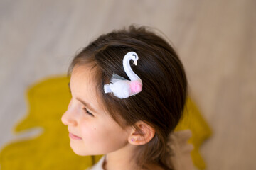 portrait of a little girl with a hairpin in her hair