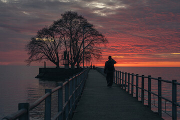 couple walking on the beach at sunset