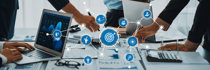 Collaborative Business Strategy Meeting with Data Analysis and Graphs for Enhanced Decision Making in Modern Work Environments. Amity