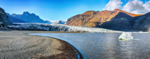 Impressive view of Skaftafellsjokull glacier tongue and volcanic mountains around on South Iceland.