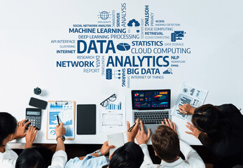 A diverse group of professionals collaboratively analyzing data in a modern office setting, utilizing charts, graphs, and technology to support informed decision-making and business strategies. Amity