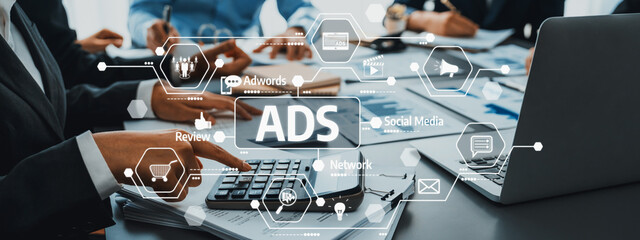 A professional business meeting scene showcasing a discussion on advertising strategies and digital...