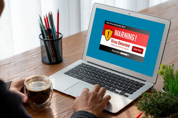 Virus warning alert on computer screen detected modish cyber threat , hacker, computer virus and...