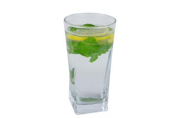 A clear glass of refreshing lemonade with lemon slices and fresh mint leaves, isolated, concept of healthy drinks, summer refreshments, and natural ingredients.
