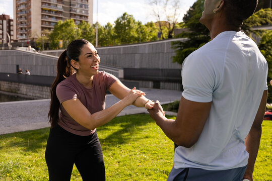 Friends enjoying workout together outdoors