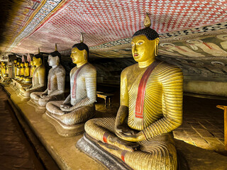 Interior of the second Cave of the Great Kings (Maharaja Viharaya), seated Buddha, Dambulla Cave temple, Sri lanka