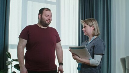 Man with overweight talking to the doctor to make personal training and diet.
