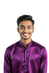 A young man with dark hair and a warm smile confidently gazes at the camera, wearing a vibrant purple shirt against a soft gray background.