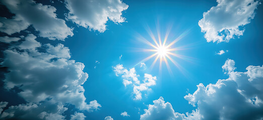 Bright Sun Shining Through Fluffy Clouds in Clear Blue Sky.
