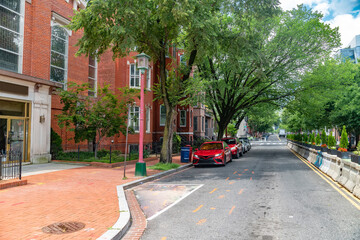 Old brick architecture on Capitol Hill. Urban streetscape with historic townhouses.