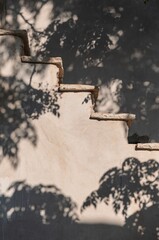 Light and Shadows on a Pastel Staircase in Folegandros, Greece