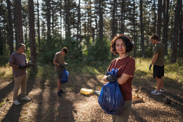 Portrait of caucasian mature woman activist volunteer clean forest