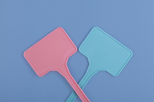 Plastic signs. Garden labels or plant markers on blue background. Design element, space for text