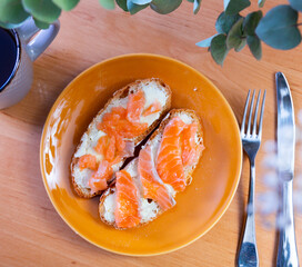 Appetizing salmon sandwich served on dish in restaurant