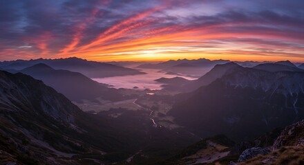 Panoramic Sunset over Majestic Mountains: A breathtaking panoramic view unfolds, revealing towering mountains kissed by the vibrant hues of a fiery sunset.