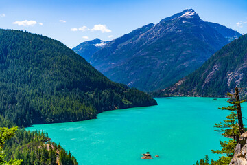 Diablo lake with mountain landscape. Landscape of mountain peak and Diablo lake. Nature landscape. Diablo Lake in North Cascades National Park. Scenic nature view over Diablo lake
