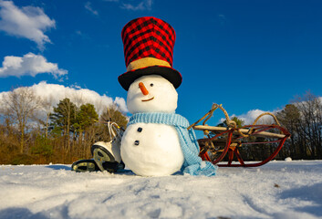 Snowman on winter card. Playful snowman outdoors. Snowman in snowfall. Winter vacation vibes. Funny...