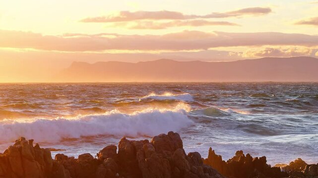 Ocean Waves at Sunset on Scenic Coastal Beach