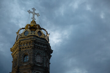 Beautiful style old gold cross on the top [art of church building on nature dark evening light on...