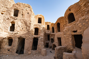 View of old Ksar Mgabla architecture with ruined storage areas in Tunisia