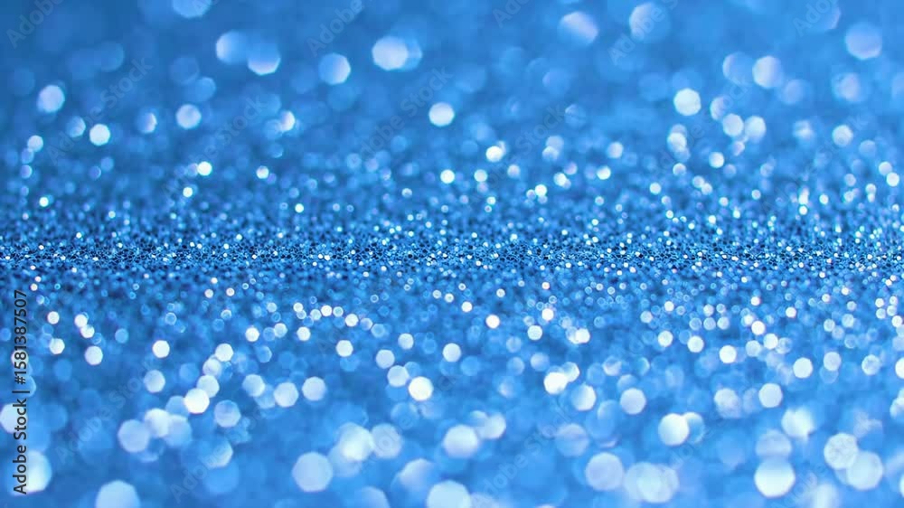 Wall mural blue glitter background with bokeh effect and shallow depth of field