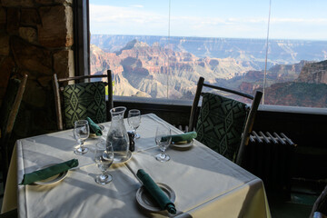 Dining room table with a view into the Grand Canyon from the historic lodge on the north rim of Grand Canyon National Park, summer vacation, Arizona, USA
