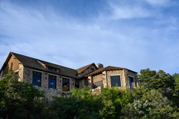 Looking up at the back side of the historic log and stone guest lodge on the north rim of Grand Canyon National Park, summer vacation, Arizona, USA
