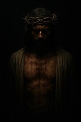 Fototapeta premium God Jesus in a Crown of Thorns, Standing in the Dark, a Symbol of Punishment for Sins