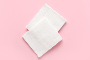 Paper napkins on pink background