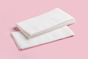 Paper napkins on pink background