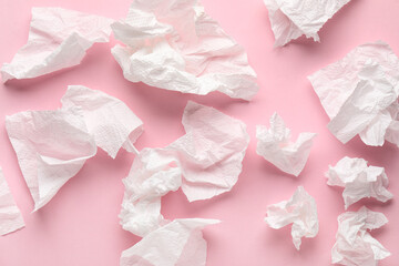 Crumpled paper napkins on pink background