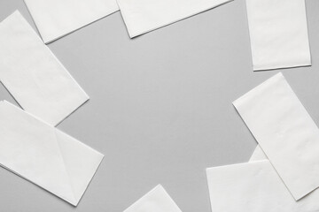 Frame made of paper napkins on grey background