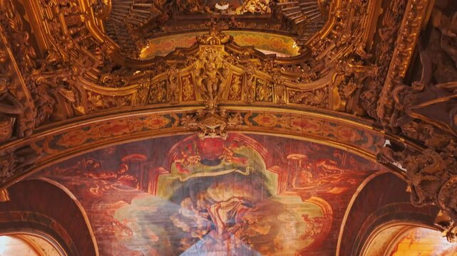 Braga Cathedral Interior displays gilded baroque chapels marble pulpits and a high ceiling vaulting over devotional visitors in Braga, Portugal