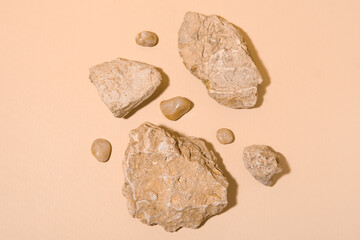 Different sea stones on beige background