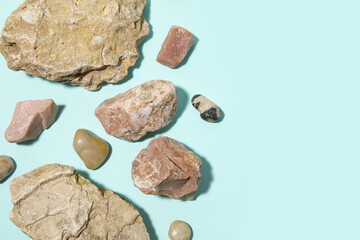 Different sea stones on blue background