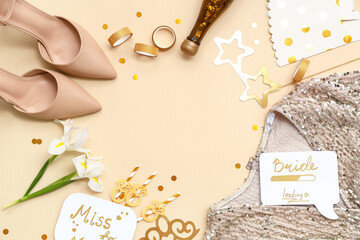 Frame made of bride's accessories on beige background. Hen Party
