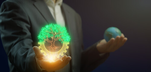 Green Tech and Sustainability concept, Eco-friendly technology interface with clean energy data, carbon tracking, and green business solutions. Big tree and gear icon on virtual screen.
