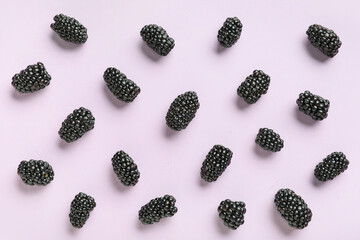 Fresh ripe blackberry on lilac background, closeup