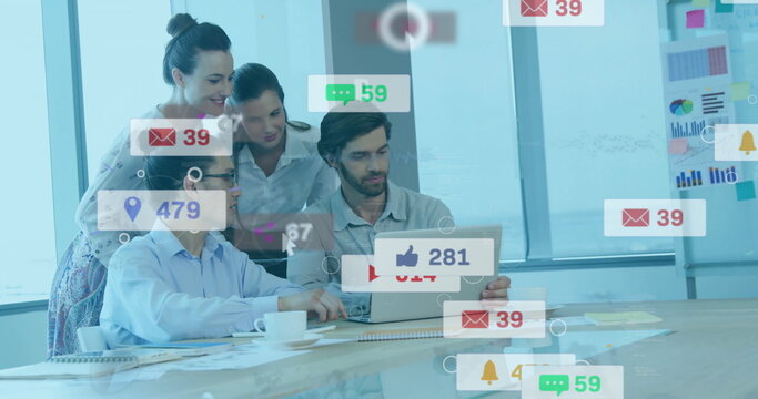 Collaborating four coworkers analyzing laptop social media icons in meeting room, with coffee cups