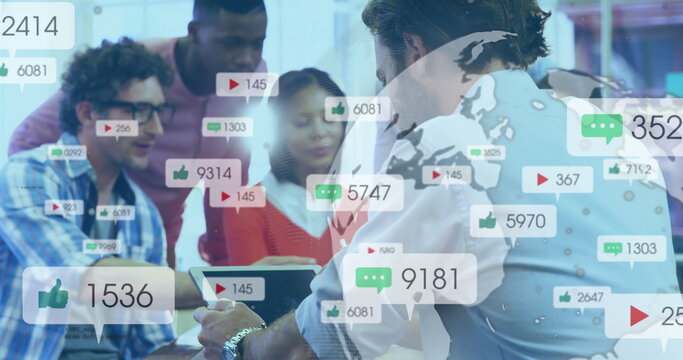 Reviewing six professionals analyzing media metrics overlay on tablet with laptop at office table