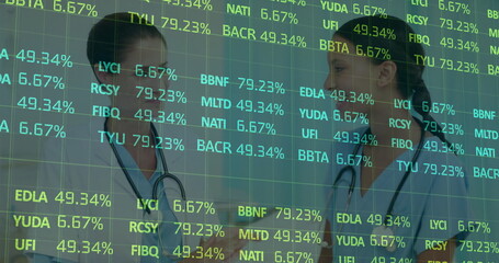 Discussing medical staff in scrubs analyzing overlay in clinic with digital codes and stethoscopes