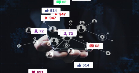 Hand wearing suit holding smartphone at center, projecting holographic icons with metrics in studio