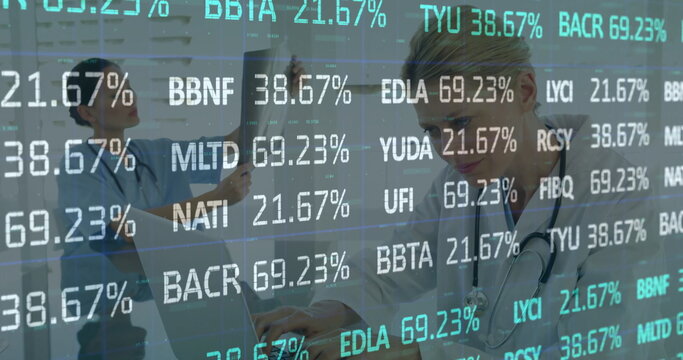 Stethoscope-wearing Asian doctor typing on laptop in clinic, with x-ray film and codes, copy space