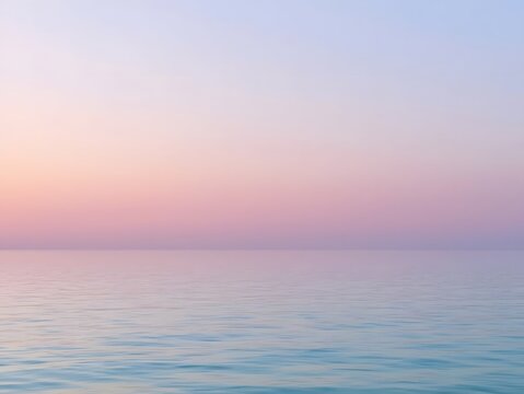 Calm pastel pink and blue horizon over a smooth sea during sunset, creating a serene and minimalistic atmosphere perfect for backgrounds, wellness, relaxation, and nature-themed designs

