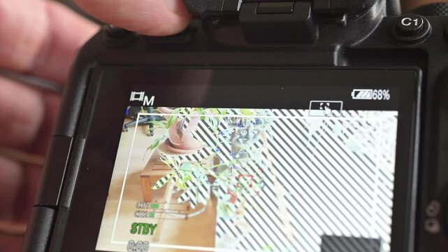 Close up of photo video camera in action