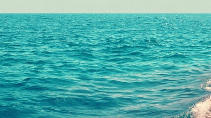 Calm Blue Ocean Water Surface with Gentle Waves in Clear Day