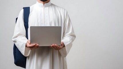 Close Up of a Muslim Student Holding a White Laptop : Suitable for Be Used in Blog Posts, Social Media Posts or Website Content Related to People and Education Theme.