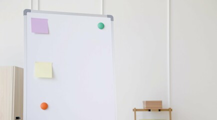 Whiteboard with colorful notes and magnets in a bright office